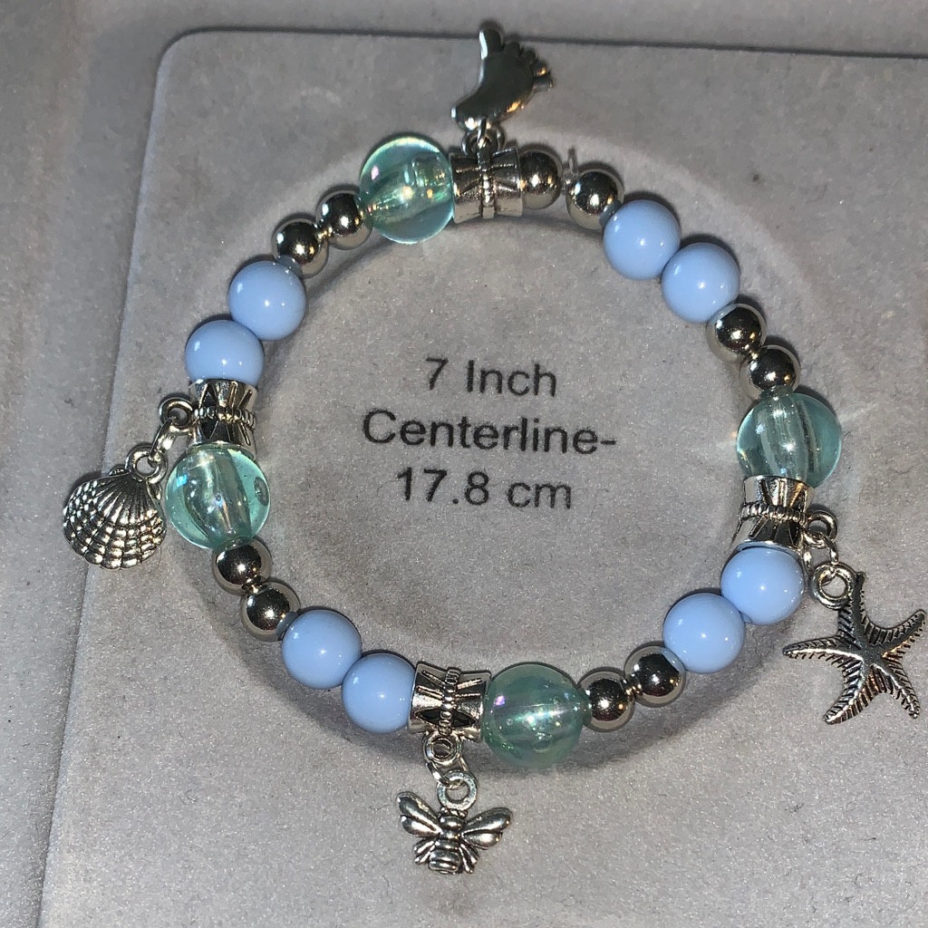 Blue Iridescent And Silver Stretch Bracelet With Beach Charms